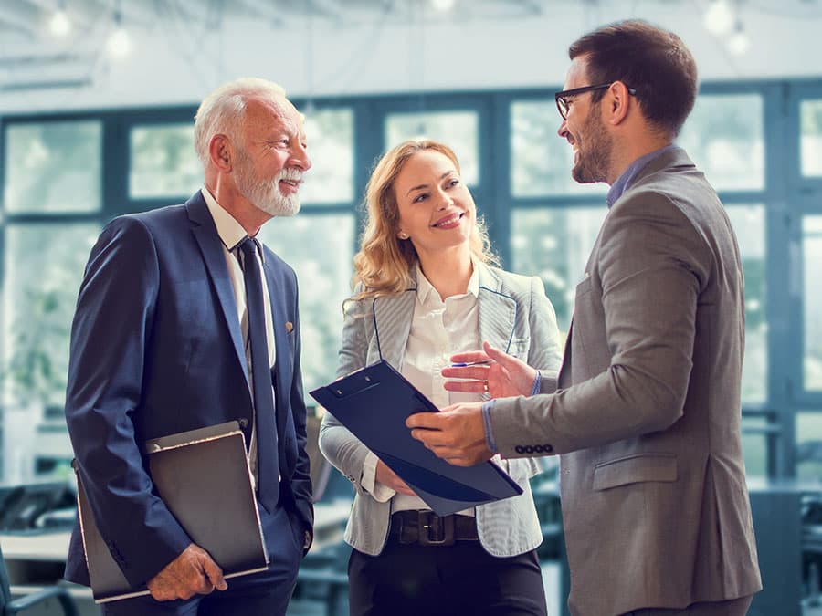 Happy business team brainstorming on project in office.